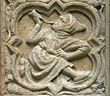 Panel 03:04 - Hooded man blowing a horn